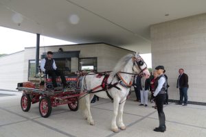 A horse and cart arrival outside the crematorium building